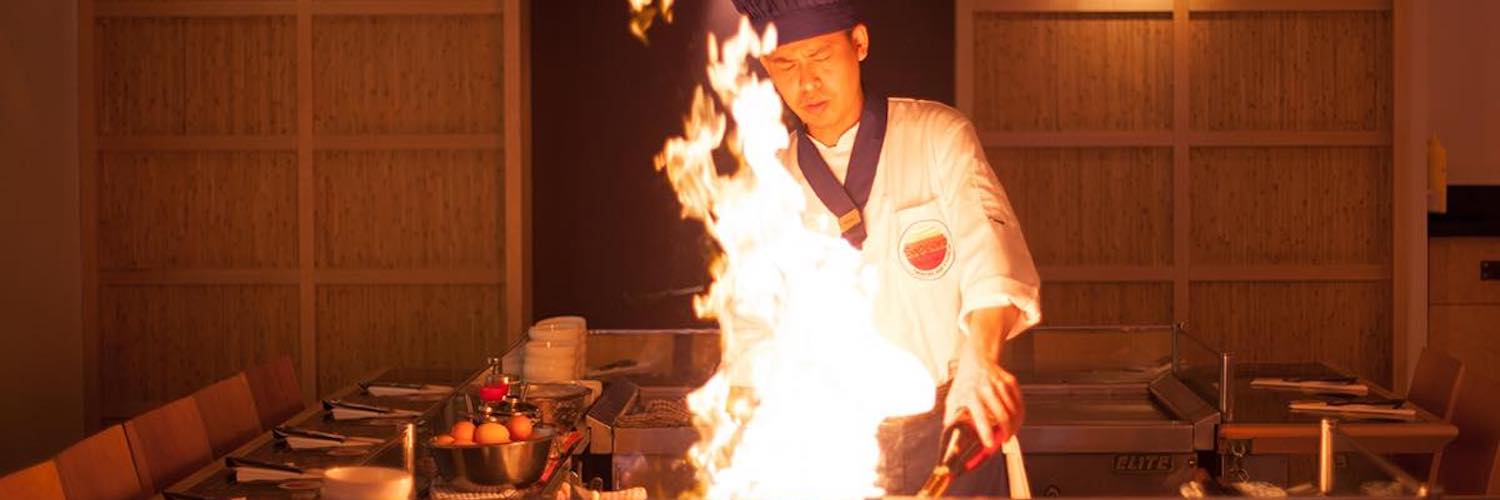 Cooking with fire on the grill at Sapporo Teppenyaki Restaurant Manchester