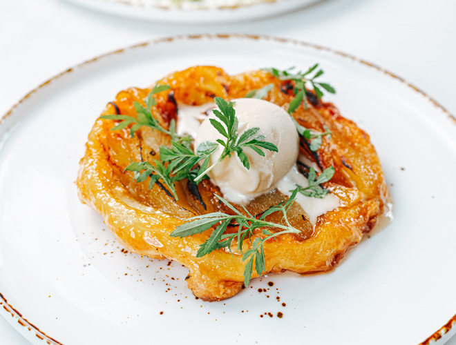 Pear tarte tatin with fresh herbs at The Black Friar