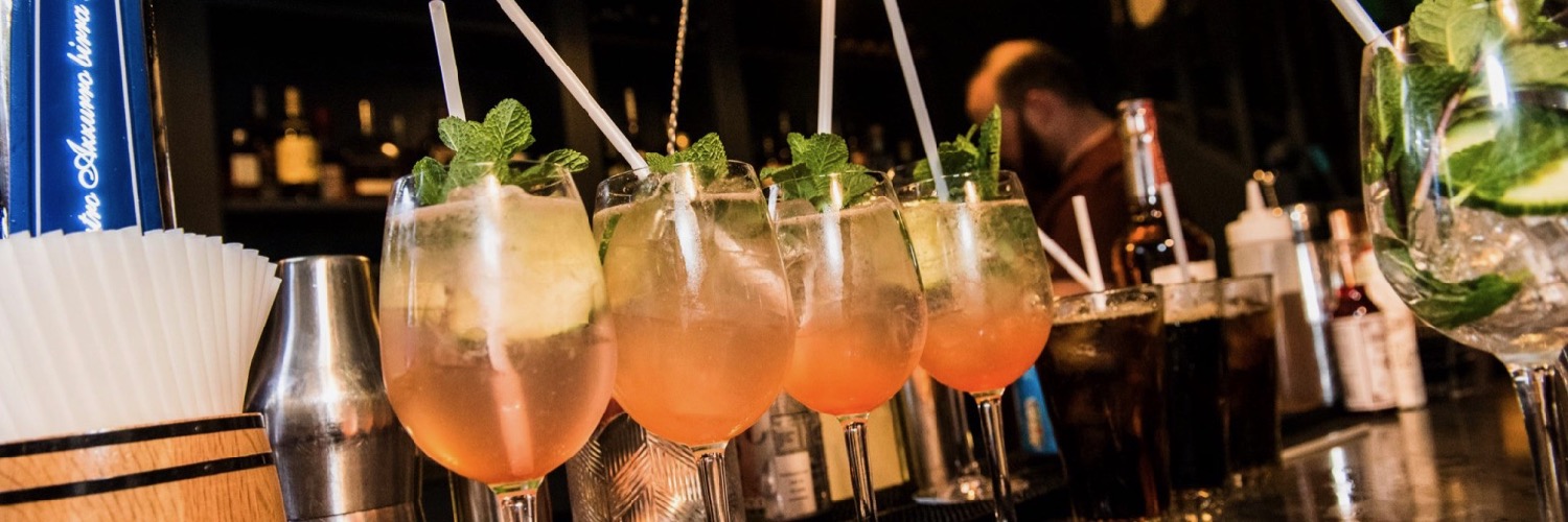 Cocktails lined up on the bar at Hope & Smoke, a grill restaurant and bar in Allerton, Liverpool.