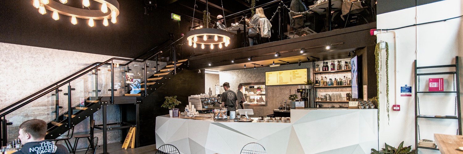 The interior of Grindsmith Media City - a popular coffee and brunch spot in Salford Quays, Greater Manchester