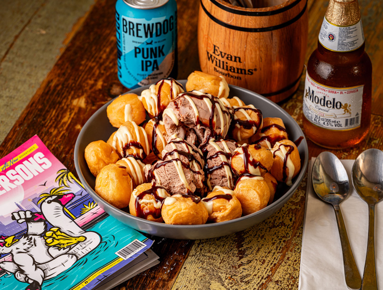 Indulgence, profiteroles topped with ice cream and chocolate sauce at Pattersons, Liverpool