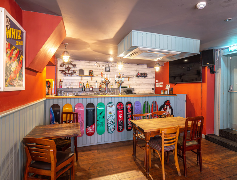 Interior, skateboards and a bar at Pattersons, Liverpool