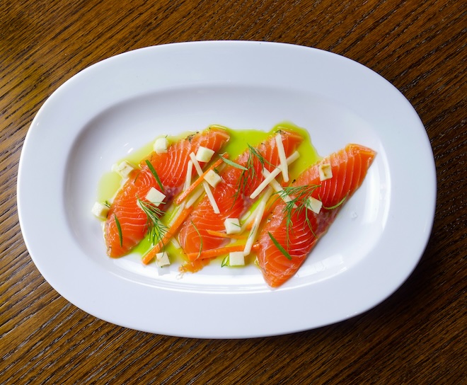 A dish of cured sea trout gravlax with ‘The Art School’ gin, summer roots salad, pickled Granny Smith, roasted garlic and lemon dressing at Barnacle in Liverpool.