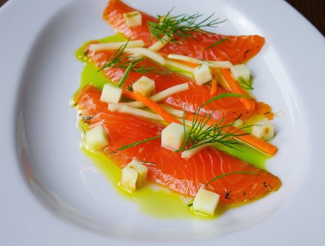 A dish of cured sea trout gravlax with ‘The Art School’ gin, summer roots salad, pickled Granny Smith, roasted garlic and lemon dressing at Barnacle in Liverpool.