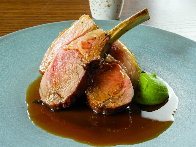 A dish of Herb-Crusted Rack of Lamb, sautéed parsley root, garden pea purée and minted lamb jus at Barnacle n Liverpool.