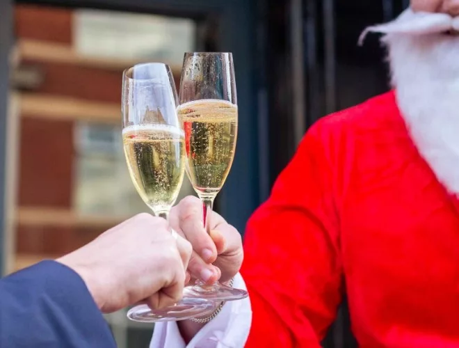 Santa enjoys a glass of Champagne at Barnacle