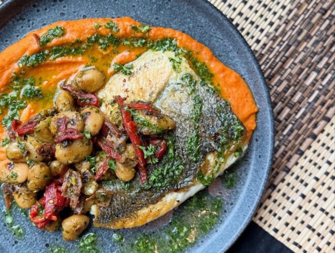 Seabass a la plancha served with smoky butter bean and piquillo pepper purée, pan-fried beans, salsa verde, crispy jamón at The Beeswing Wine Bar and Kitchen in Manchester.