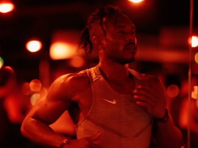 A man running in the Red Room at Barry's.