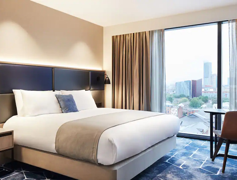 King size Bedroom with city views at Manchester's Hyatt Regency hotel