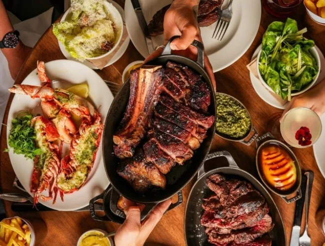 A selection of sides and dishes at Hawksmoor Liverpool including lobster and a magnificent sharing platter of beef