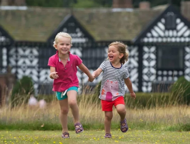 Children running in the gardens at Speke Hall