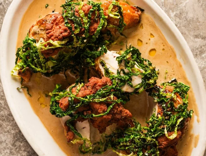 Whole chicken KFC, fermented mushroom butter sauce & greens at Nord
