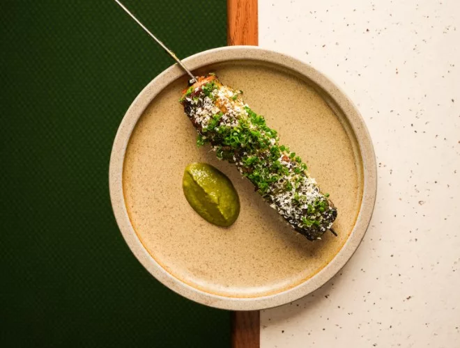 pork belly skewer with wild garlic and caper pistou at Nord
