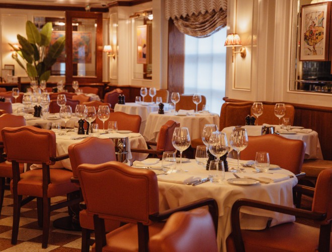Restaurant interior at San Carlo Alderley Edge with leather chairs