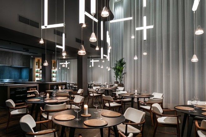 Mana interior with tables and hanging lights