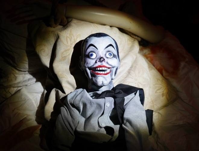 An uncanny doll waits for you in the Cabinet of Curiosities at Journey to Hell at Blackpool Pleasure Beach
