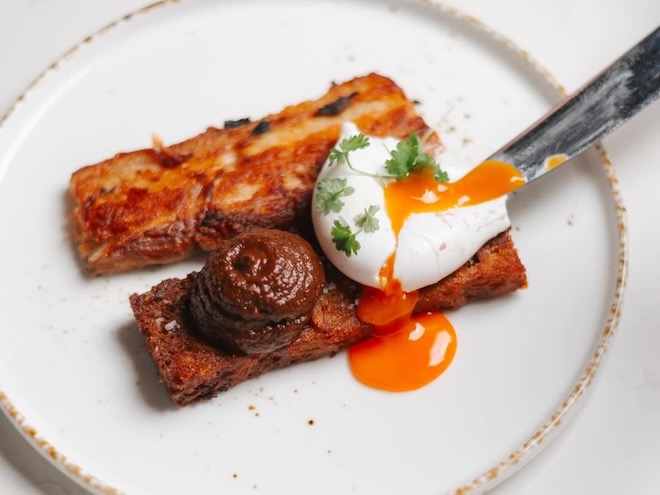 Crispy confit pork belly, potato rosti, poached egg and mushroom ketchup at Black Friar in Salford.