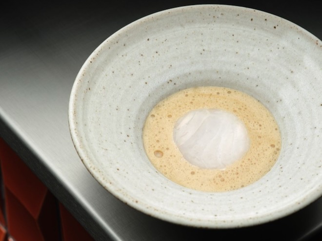 Steamed West Coast cod with whey Roscoff onion, smoked eel, and buttermilk at Skof.