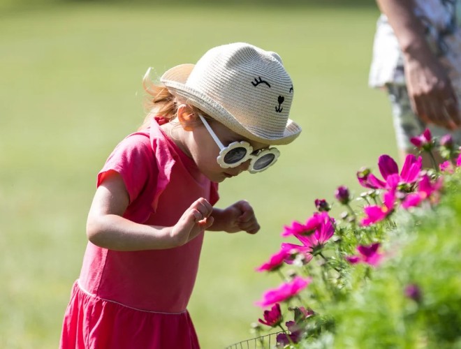 Girl looking at flowers