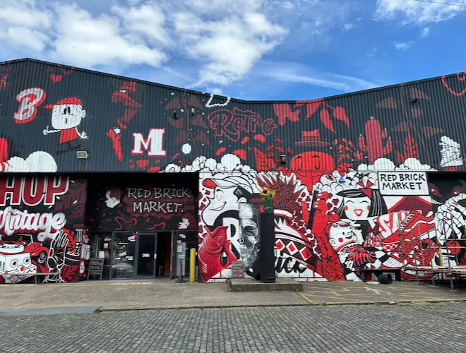 The red and black street art on the exterior of Red Brick Market in Liverpool.