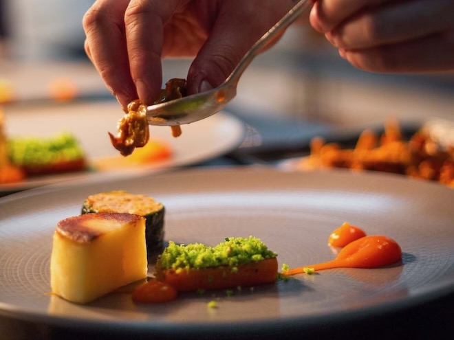 A chef preparing a dish at The Art School in Liverpool.