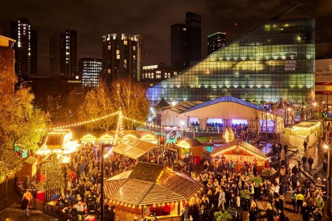 Manchester Christmas Markets at night, lighting up Exchange Square