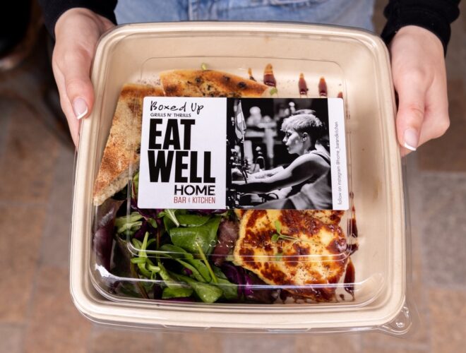 A takeaway box of halloumi salad and flatbread with Eat Well on the label, from HOME in Manchester.