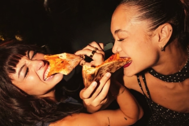 Girls sharing pizzette at Frederiks