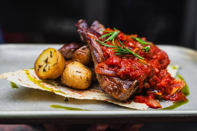 Lamb cutlet and roast potatoes at La Famiglia