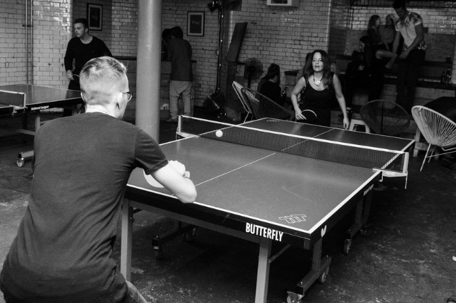 A man and a woman playing table tennis at Twenty Twenty Two