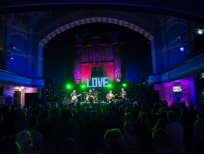 A crowd watching a Beatles tribute band in Liverpool.