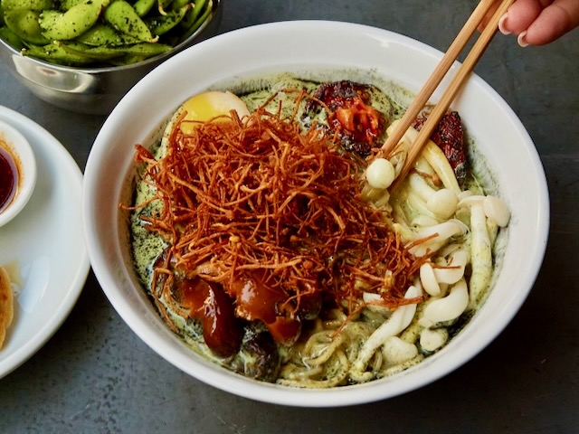 A bowl of ramen with kinoko, edamame and gyoza at Ramenshop in Manchester.