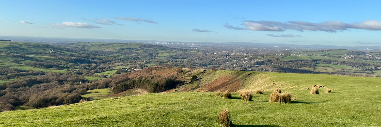 Coombes Edge with Manchester in the distance.