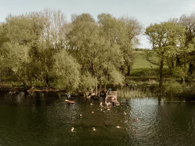 A group of people swimming at The Farm Club, Pickmere.