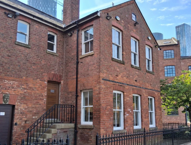 Outside Saul Hay Gallery, formerly the area's Railway Cottage, in Castlefield.