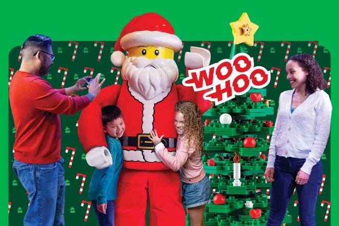 Children with a giant Lego Santa and a Lego Christmas tree