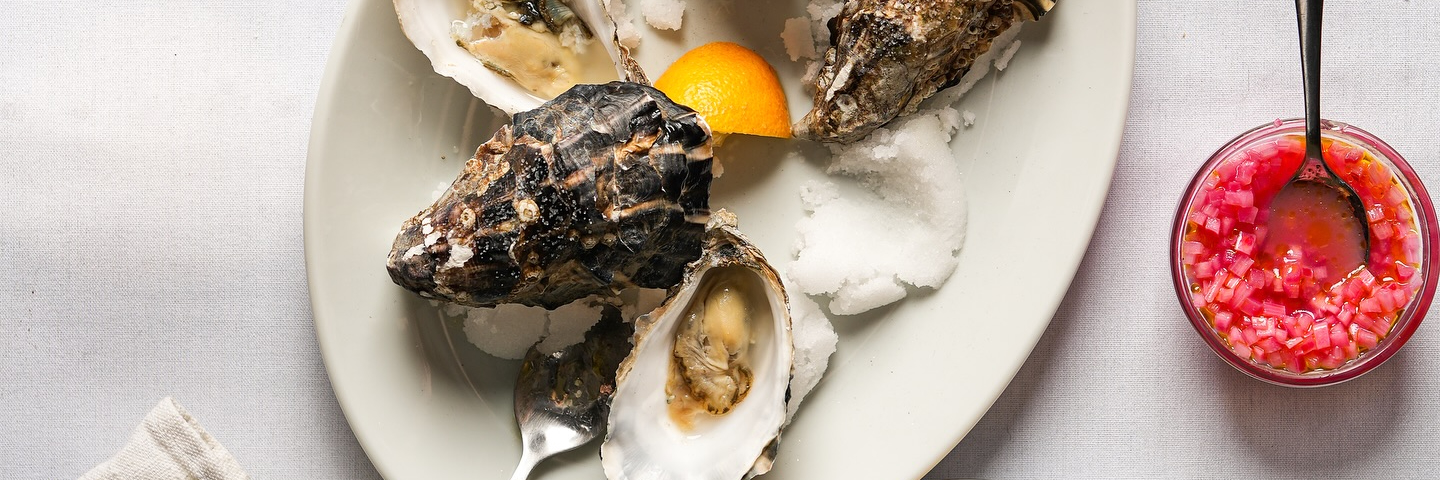An oval dish of oysters with lemon quarters served at Winsome in Manchester.