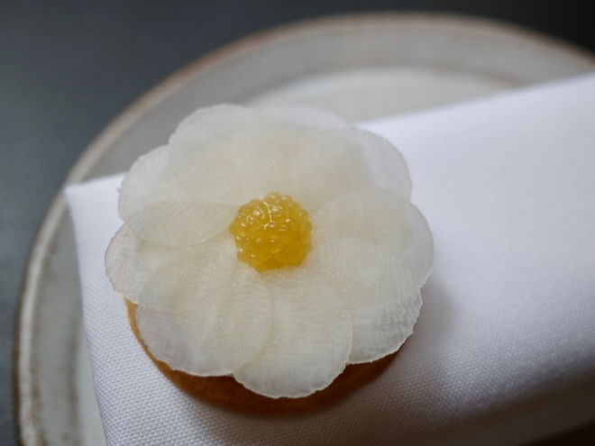 The Spenwood cheese biscuit with crushed artichoke bound in whipped cod's roe and topped with pike roe and shiso at Skof in Mancheter. ⁠