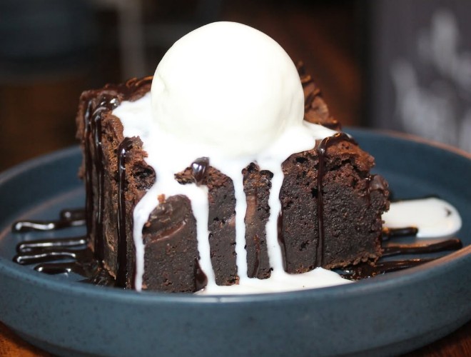 Chocolate brownie with ice cream at Frederiks