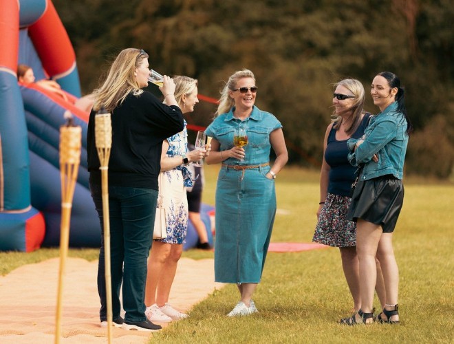 A relaxed group of people chatting at Swanley Meadows