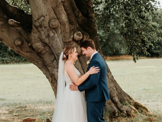 A couple getting married under a tree