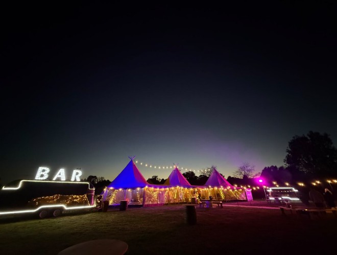 Your tipi wedding lit up at night