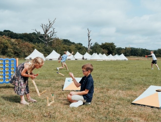 Children playing with outdoor games at a wedding at Swanley Meadows