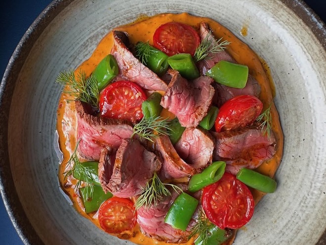 Marinated Flank Steak with sugar snap peas, cherry tomatoes and tuna n’duja at Engine Social Dining.