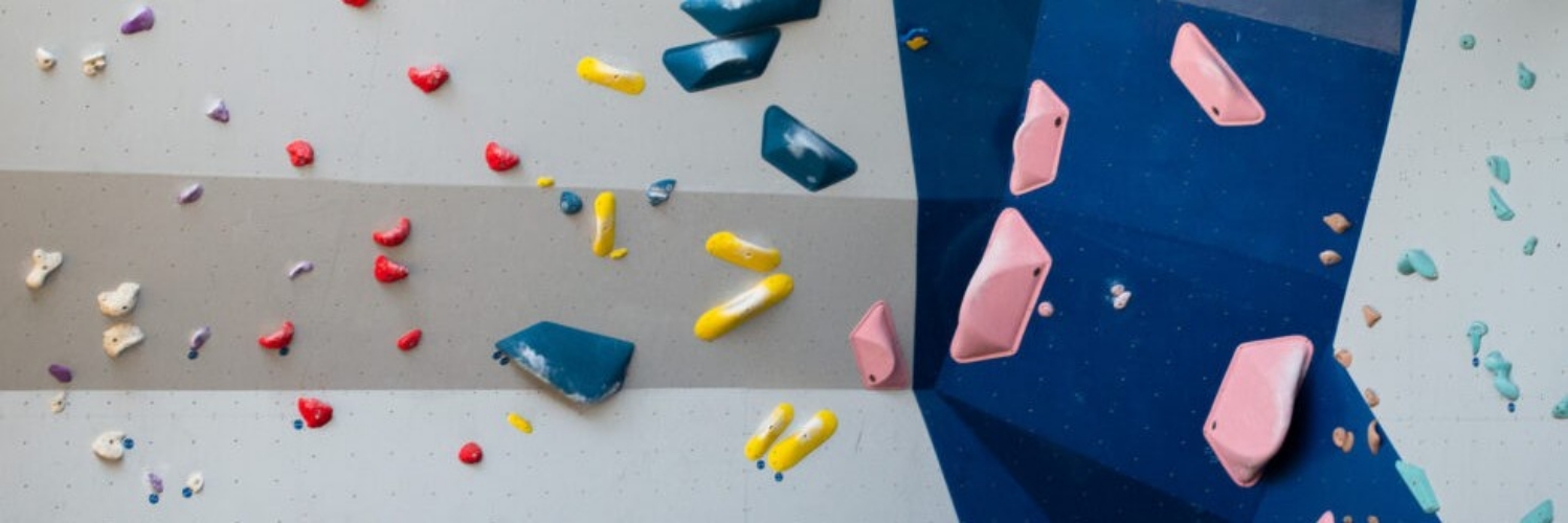 An array of wall angles and primary-coloured bouldering routes