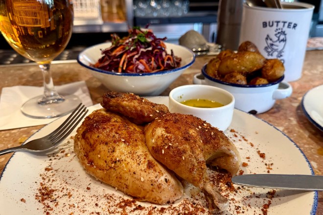 Half a roast chicken with a slaw and potato side from Butter Bird