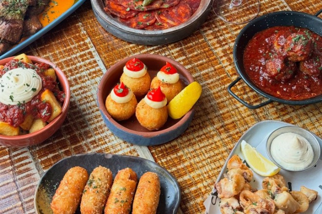 Tapas at El Gato Negro in Manchester including croquetas and squid