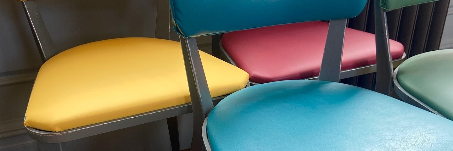 Brightly coloured chair seats at Insitu, Manchester.