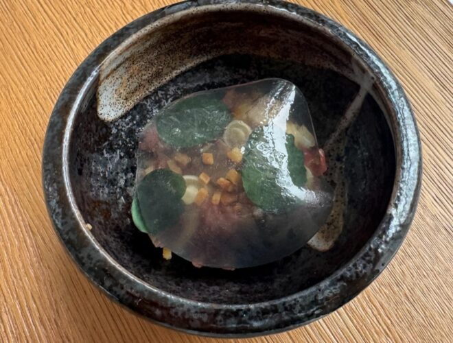 Salt aged beef tartare, smoked eel, soy mayo, pickle shimeji mushrooms, mini croutons covered with a dashi veil at Vetch in Liverpool.