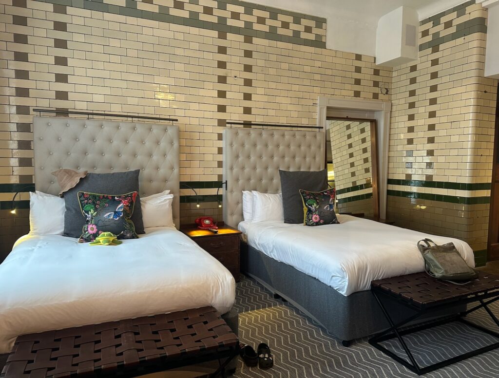 A double-double bedroom at The Kimpton Clocktower Hotel.